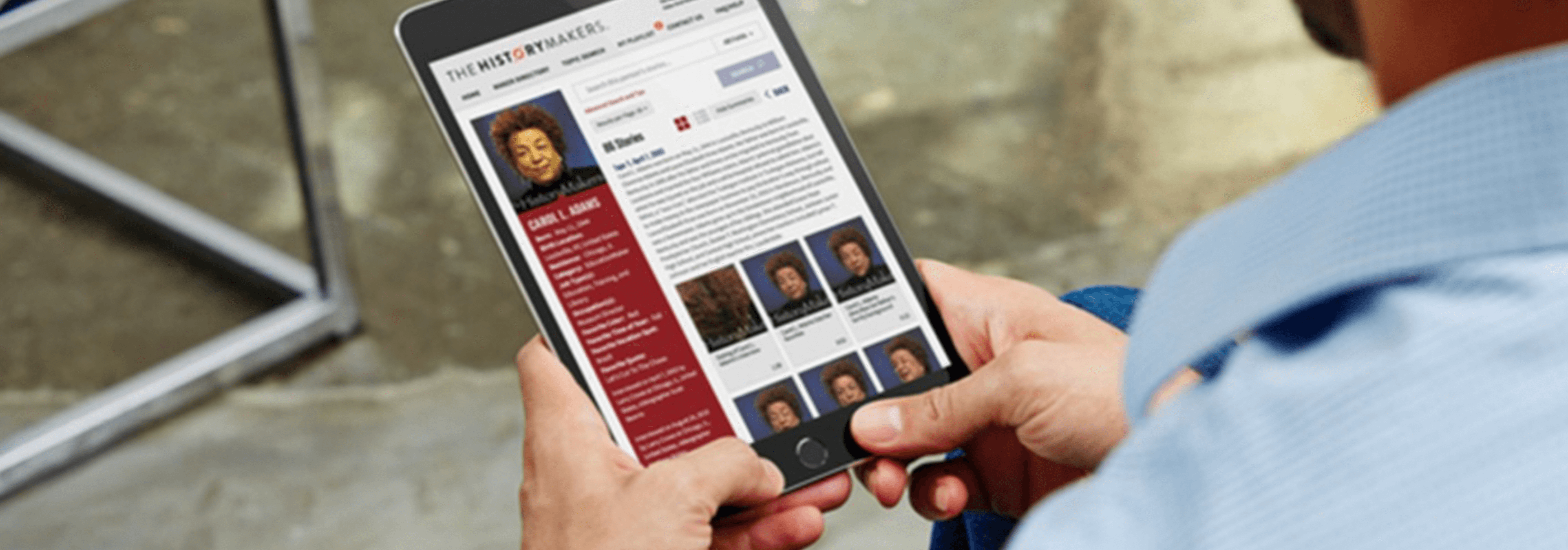 Person reading tablet with a HistoryMaker profile on screen